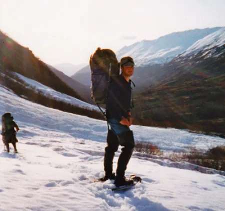 Billy Molls packing a bear hide on an Alaska hunt